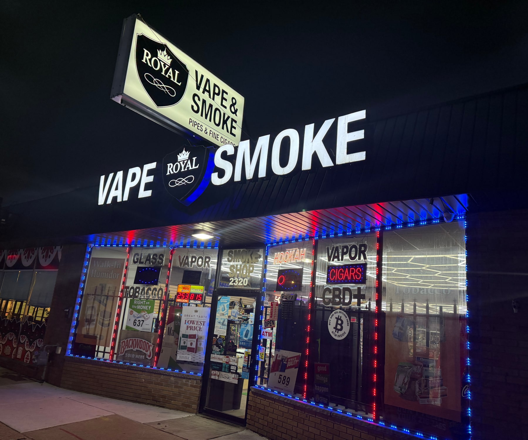 Royal Vape And Tobacco storefront at night